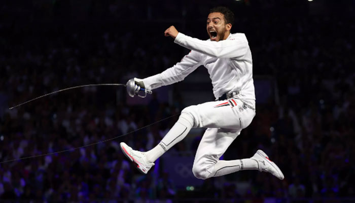 Egypts Mohamed Elsayed celebrates during a fencing match. — AFP/file