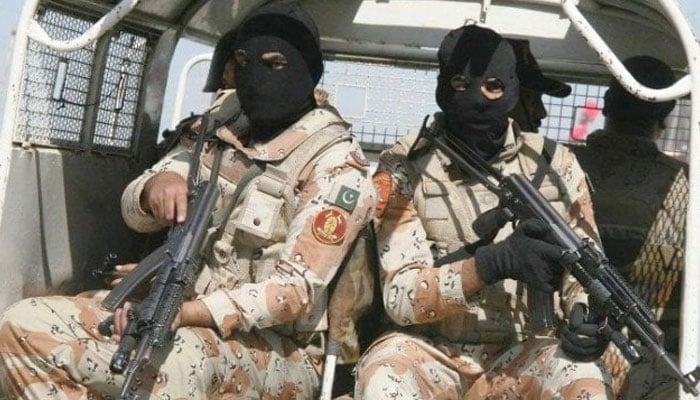 This undated picture shows Sindh Rangers personnel patrolling in an area on a vehicle. — APP/File