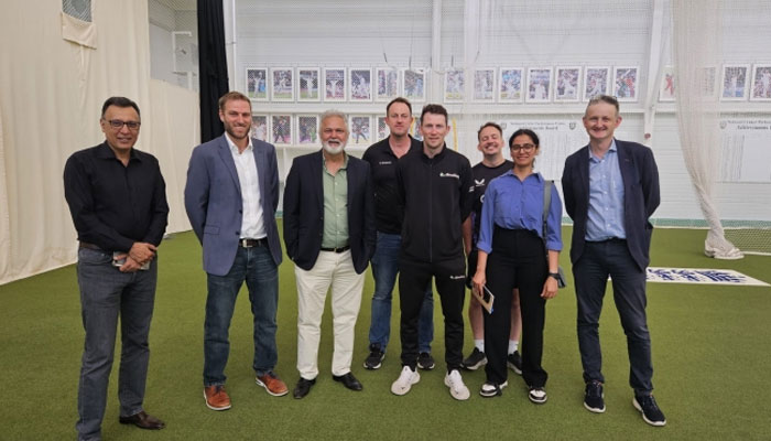 PCB Director High-Performance Center Nadeem Khan poses for a group photo with others during his visit to DineticQ on July 30, 2024. — PCB