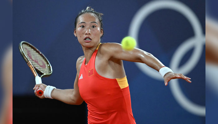 Chinas Zheng Qinwen returns to Germanys Angelique Kerber during their womens singles quarter-final tennis match on Court Philippe-Chatrier during the Paris 2024 Olympic Games, in Paris on July 31, 2024. — AFP