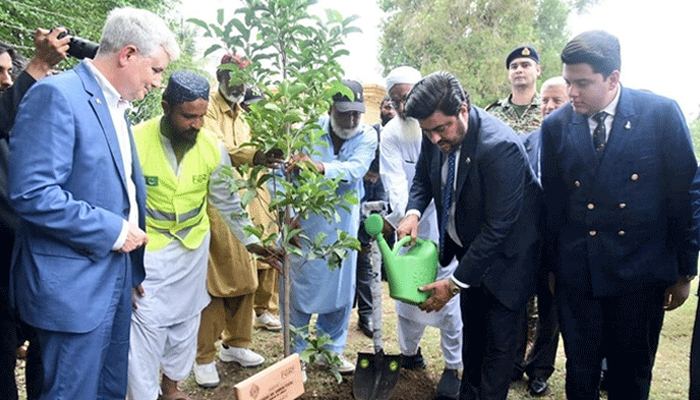 Sindh Governor Kamran Tesori pouring water to the sapling planted in Bagh Ibn Qasim Park Clifton August 1, 2024. — Facebook @TeamKTessori