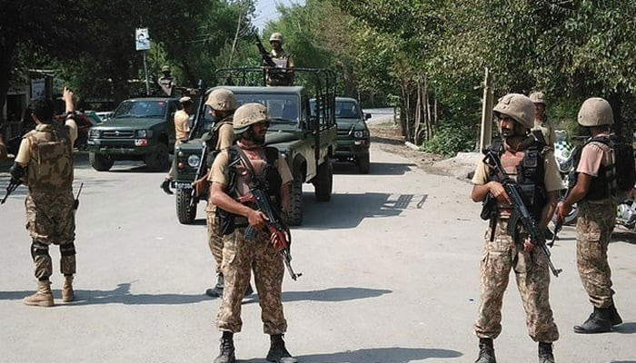 Pakistani soldiers cordon off a street on the outskirts of Peshawar. — AFP/File