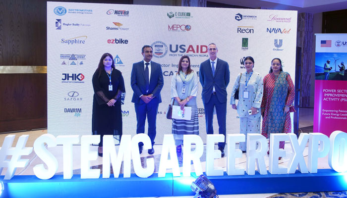 Acting USAID Mission Director James Fleming poses for a group photo with others during the celebration of the accomplishments of the second group of 24 diverse young leaders from the Empower All Energy Programme. — APP/File