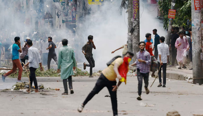 Protesters clash with Border Guard Bangladesh (BGB) and the police outside the state-owned Bangladesh Television as violence erupts across the country after anti-quota protests by students, in Dhaka, Bangladesh, July 19, 2024. — Reuters