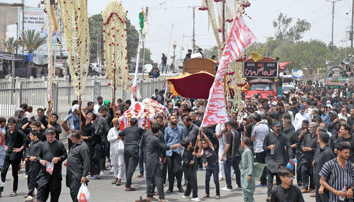 Devotees of Imam Hussain (R.A) are holding a religious mourning procession in memory of the martyrdom of Hazrat Imam Hussain (R.A), grandson of Prophet Mohammad (PBUH), in connection of 8th Muharram-ul-Haram, in Karachi on July 15, 2024. — Online