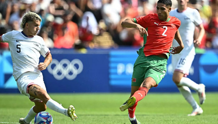 Morocco captain Achraf Hakimi fires in his sides third goal in their comfortable win over the United States in the Olympic mens football quarter-finals on August 2, 2024. — AFP