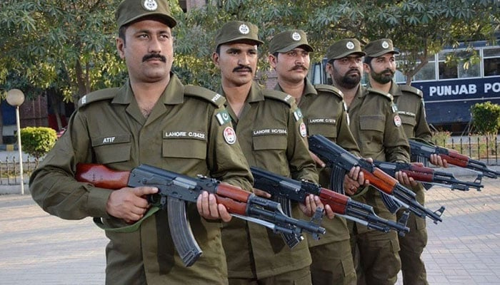 Personnel of the Punjab police pose for the photo. — APP File