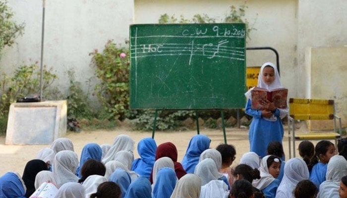 A representational image showing students attending a class at a government school. — AFP/File