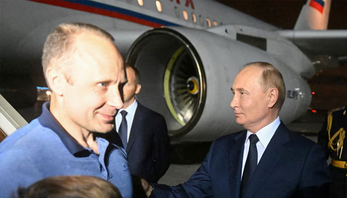 Russias President Vladimir Putin welcomes Russian national Artyom Dultsev, who was released in a prisoner exchange between Russia with Western countries, during a ceremony at Vnukovo International Airport in Moscow, Russia August 1, 2024. — Reuters