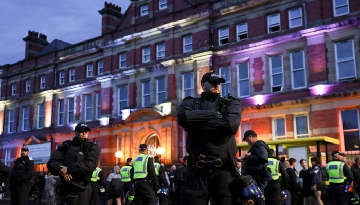 UK police officers stand alert outside a mosque during a protest in Liverpool. — Reuters/File