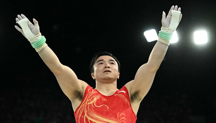 Chinas Liu Yang reacts after competing in the artistic gymnastics mens rings final during the Paris 2024 Olympic Games in Paris, on August 4, 2024. — AFP