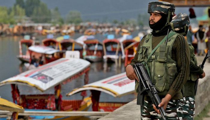 Indias Central Reserve Police Force (CRPF) personnel stand guard on the banks of Dal Lake, in Srinagar,  Indian Illegally Occupied Jammu and Kashmir (IIOJK) May 26, 2022. — Reuters