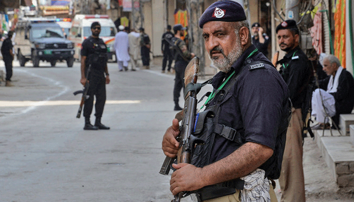 A representational image showing police personnel standing guard in Peshawar, Khyber Pakhtunkhwa on August 7, 2022. — AFP