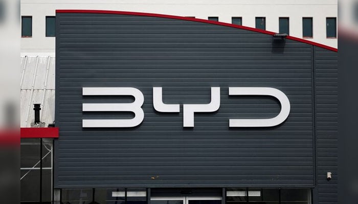 The logo of BYD is seen outside a BYD car dealer on March 27, 2024. — Reuters