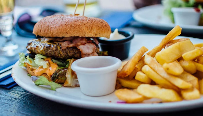 A representational image of a burger and french fries. — Pexels/File