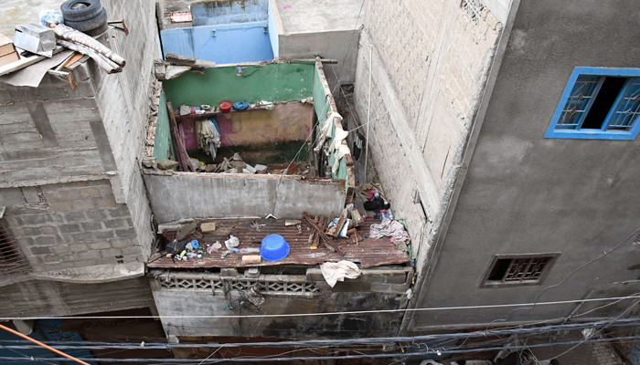 An aerial view of the collapsed roof of a house in Karachis Lyari on August 5, 2024 — Online