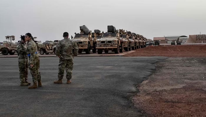 American soldiers prepare military vehicles to be loaded onto a cargo plane in Niamey as US troops begin to leave Niger. — AFP/File