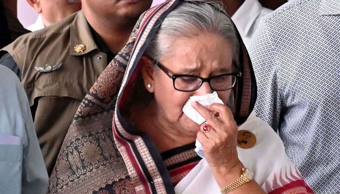 Bangladeshs now-former prime minister Sheikh Hasina weeps while she visits a metro station in Mirpur vandalised by students during the anti-quota protests in this image released on July 25, 2024. — AFP