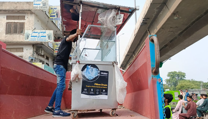 The anti-encroachment officer is removing the illegal encroachments in the Rawalpindi city and loading them into the truck seen in this image on August 6, 2024. — Facebook/@MetropolitanCorporation