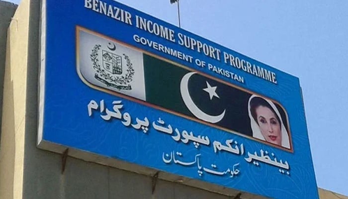 A billboard can be seen with the Benazir Income Support Programme (BISP) written on it. — APP File