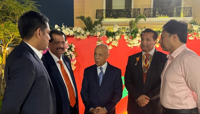 Moroccos Ambassador to Pakistan Mohamed Karmoune (centre) Honorary Consul General of Morocco  Ishtiaq baig (centre to right), Mirza Ishtiaq baig (centre to left) and other persons seen in this image. — Facebook/@BRArsalanShaikh/file