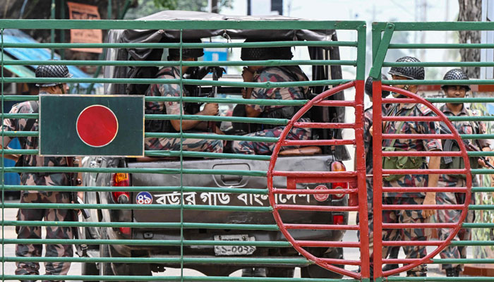 Border Guard Bangladesh (BGB) personnel stand guard at the India-Bangladesh border of Petrapole about 100km northeast of Kolkata on August 6, 2024. — AFP