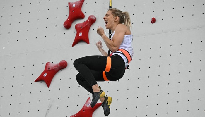 Polands Aleksandra Miroslaw competes in the womens sport climbing speed semi-final during the Paris 2024 Olympic Games in Le Bourget on August 7, 2024. — AFP