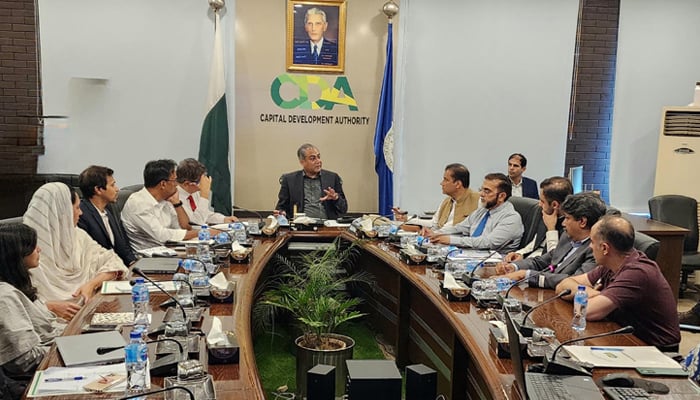 Interior Minister Mohsin Naqvi (centre), Chairman of the Capital Development Authority (CDA) Muhammad Ali Randhawa, (right to 5th) and other officials are seen in this image on August 7, 2024. — PID