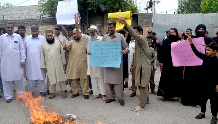 Residents of Miskeenabad are holding protest demonstration for acceptance of their demands, outside Wapda Office in Peshawar on Wednesday, August 7, 2024. — PPI