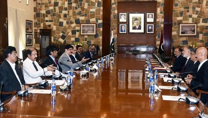 Sindh Chief Minister Syed Murad Ali Shah (left to 4th) and Chairman NAB Lt General (r) Nazir Ahamed discuss the progress of ongoing inquiries and investigations within the province at CM House Karachi on August 7, 2024. — Facebook/@SindhCMHouse