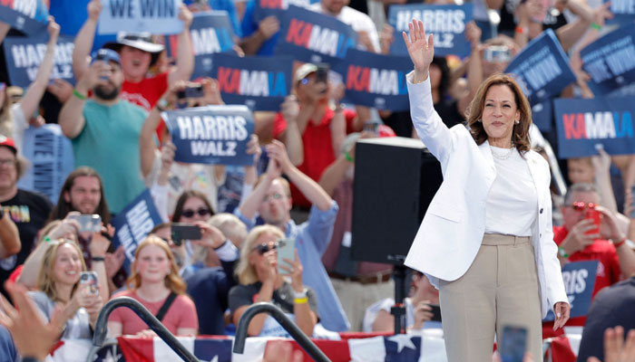 US Vice President and 2024 Democratic presidential candidate Kamala Harris waves to supporters as she departs after speaking during a campaign rally in Eau Claire, Wisconsin on August 7, 2024. — AFP