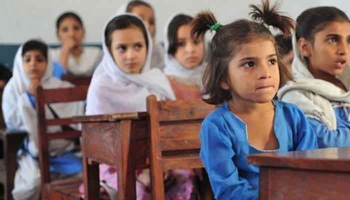 A couple of students sit in a classroom. — AFP/File