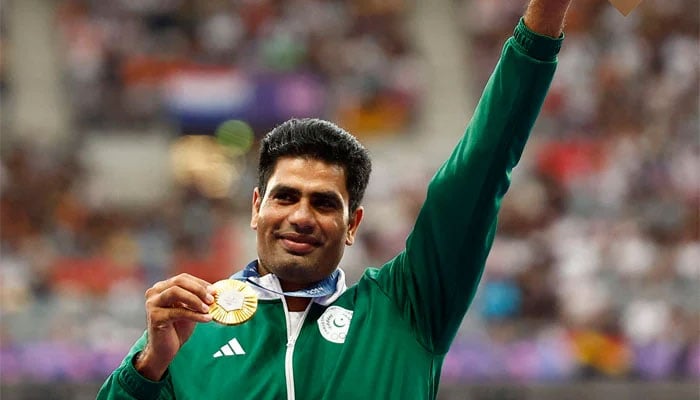 Gold medallist Arshad Nadeem celebrates with his medal on the podium at Mens Javelin Throw victory ceremony at Paris Olympics 2024 in the Stade de France, Saint-Denis, on August 09, 2024. — Reuters