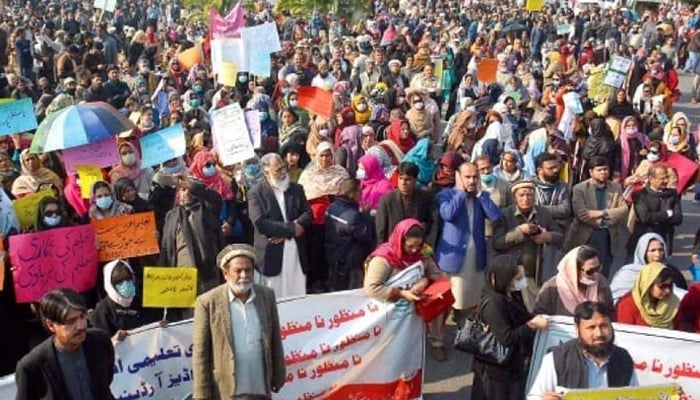 Representational image of teachers holding a protest with placards and banners as they rally for their demands to be met at D-Chowk in Islamabad. — INP/file