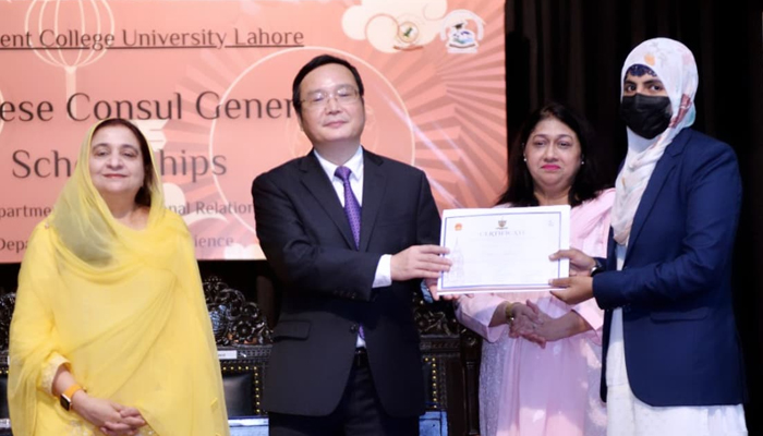 Chinese Consul General Zhao Shiren (centre) giving scholarship certificates to student on this occasion Vice Chancellor Prof Dr Shazia Bashir (left) and Head of the Political Science Department Dr Fouzia Ghani (right) are present in this image on August 9, 2024. — Facebook/@gcuniversitylhr