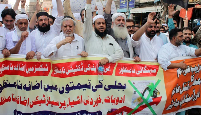 Traders of Peshawar are holding protest demonstration against prolonged electricity load-shedding and high-inflated electricity bills, at Ashraf road in Peshawar on Monday, July 1, 2024. — PPI