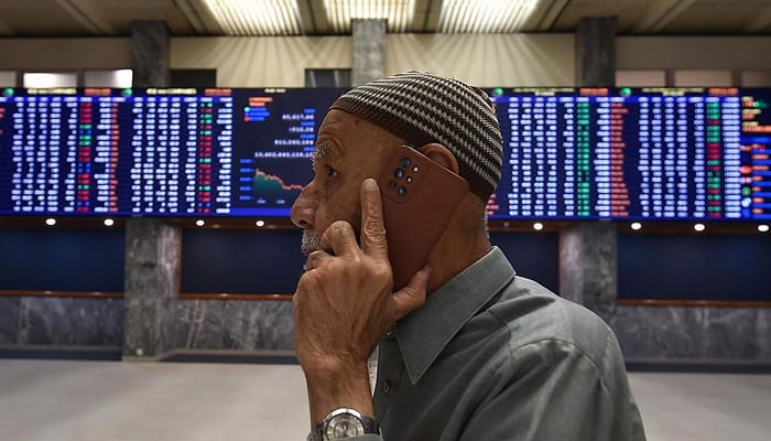 A stockbroker monitors the share prices during a trading session at the Pakistan Stock Exchange (PSX) in Karachi. — INP File