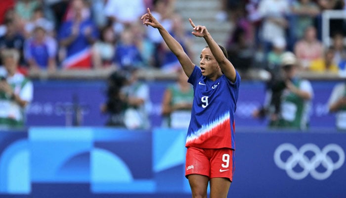 US Mallory Swanson celebrates scoring the opening goal in the womens gold medal final football match between Brazil and the US during the Paris 2024 Olympic Games in Paris on August 10, 2024. — AFP