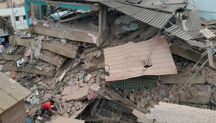 A representational image of destroyed house by collapsed roof. — APP/file