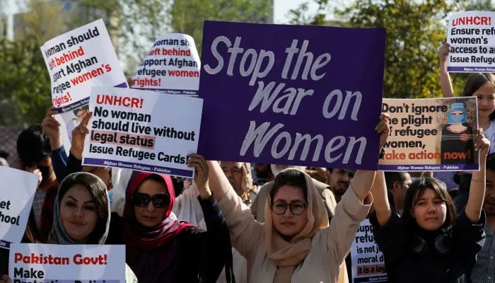 A representational image showing women carrying placards as they participate in an event on the occasion of International Women’s Day in Islamabad. — Reuters