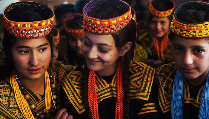 A representational image showing Kalash students attend a class at a school in the Brun village of Bumboret valley. — AFP/File