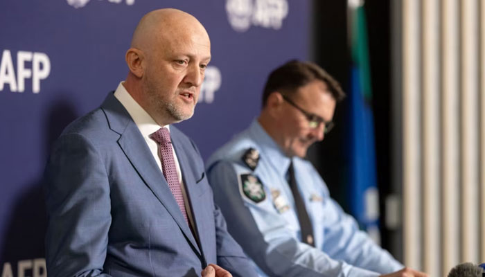 A handout photo taken on July 12, 2024, shows Australias Director-General of Security and head of the ASIO Mike Burgess (left) speaking at a press conference in Canberra. — AFP