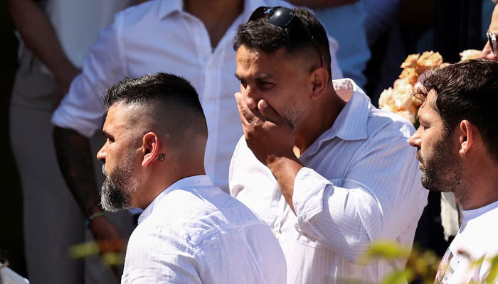 Sergio Aguiar, the father of Alice Da Silva Aguiar, looks on as her coffin arrives at St Patricks Catholic Church, in Southport, Britain on August 11, 2024. — Reuters