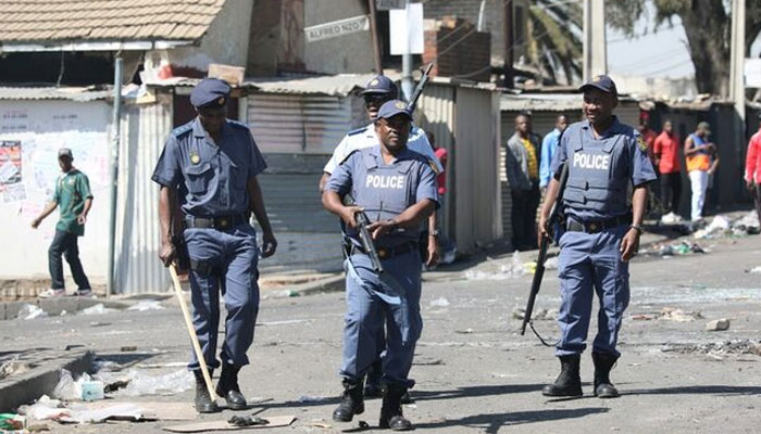 Police personnel standing guard on the street of Alexandra township, Johannesburg, South Africa. — Reuters/File