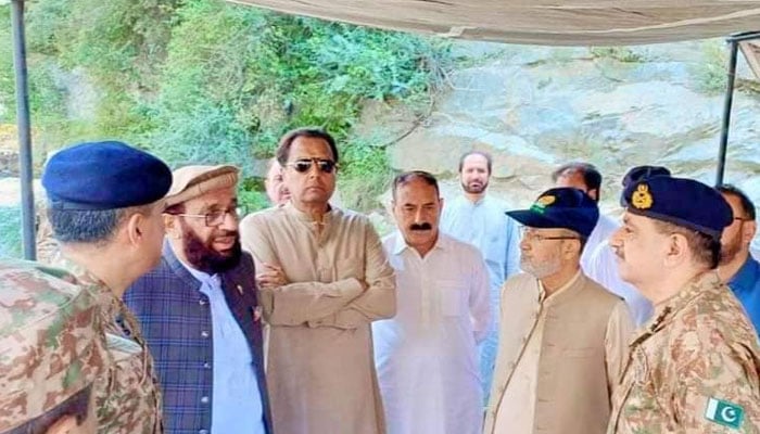 Captain (retd) Mohammad Safdar (centre) pictured alongside PML-N MNA Sardar Mohammad Yusuf (third left) along with Pakistan Army officials during the reopening ceremony of a bridge connecting KP with Gilgit-Baltistan in this image released on August 12, 2024. — Facebook/Capt (R) Muhammad Safdar Awan [Official]