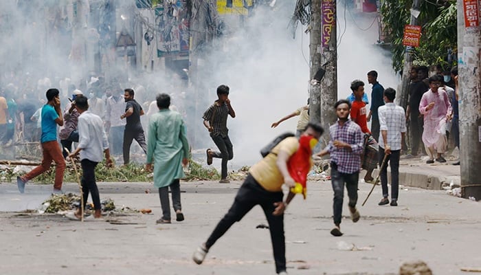 Protesters clash with Border Guard Bangladesh (BGB) and the police outside the state-owned Bangladesh Television as violence erupts across the country after anti-quota protests by students, in Dhaka, Bangladesh, July 19, 2024. — Reuters