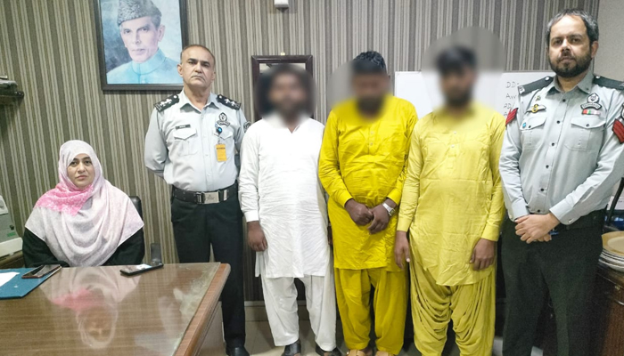 Out of the 11 passengers who were arrested from Jinnah International Airport for begging under the guise of Umrah, 3 passengers are present with FIA officials image released on August 12, 2024. — Facebook/@FIAAgencyOfficial