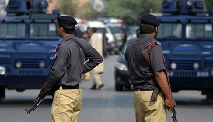 A representational image showing two policemen standing at an undisclosed location. — AFP/File