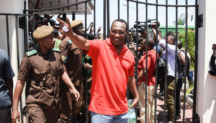 Tanzanias main opposition Chadema party chairman Freeman Mbowe (C) who was arrested on July 21, 2021, reacts as he arrives at the High Court in Dar es Salaam, Tanzania, on February 18, 2022. — AFP