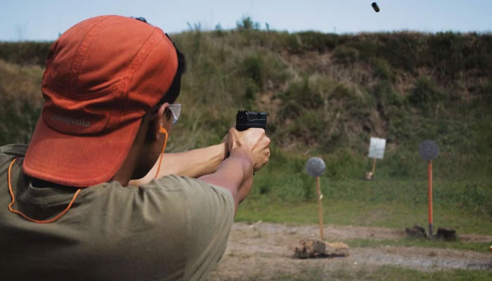 This image shows a person at a shooting range. — Unsplash/File